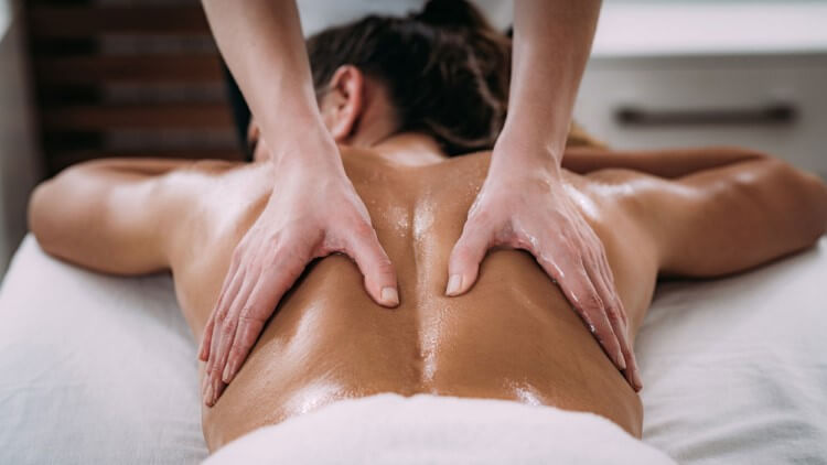 A person enjoying a relaxing Swedish Massage.